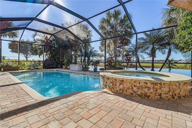 view of swimming pool with an in ground hot tub, a lanai, and a patio