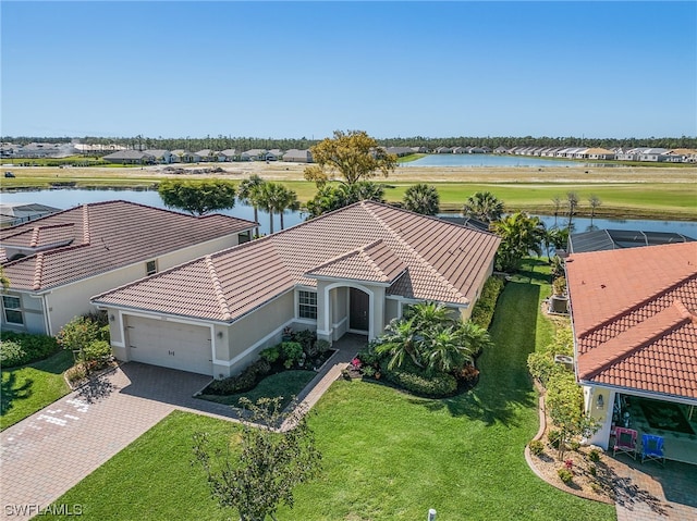 birds eye view of property with a water view