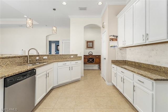 kitchen with decorative light fixtures, sink, dark stone countertops, white cabinets, and dishwasher