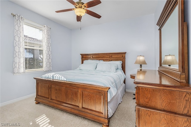 bedroom with light carpet and ceiling fan