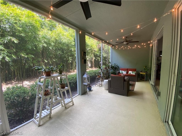 sunroom with a ceiling fan