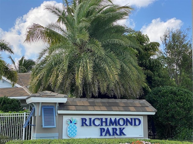 community sign with fence