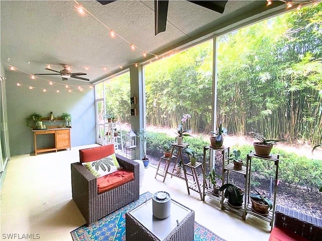 sunroom featuring a ceiling fan