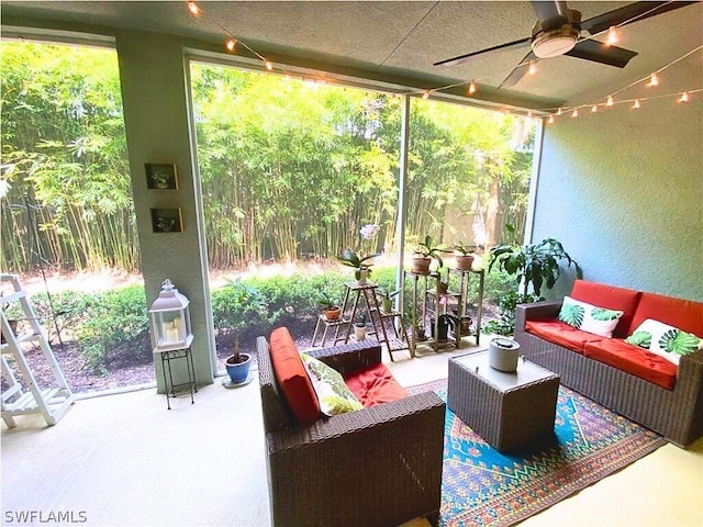 sunroom featuring a ceiling fan