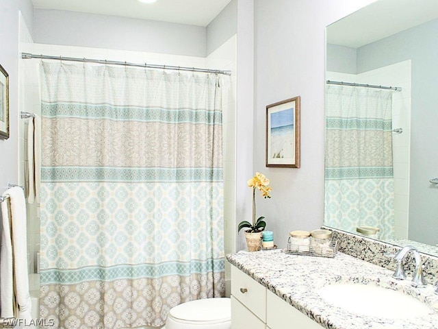 bathroom with vanity, toilet, and a shower with curtain