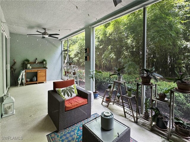 sunroom / solarium with ceiling fan