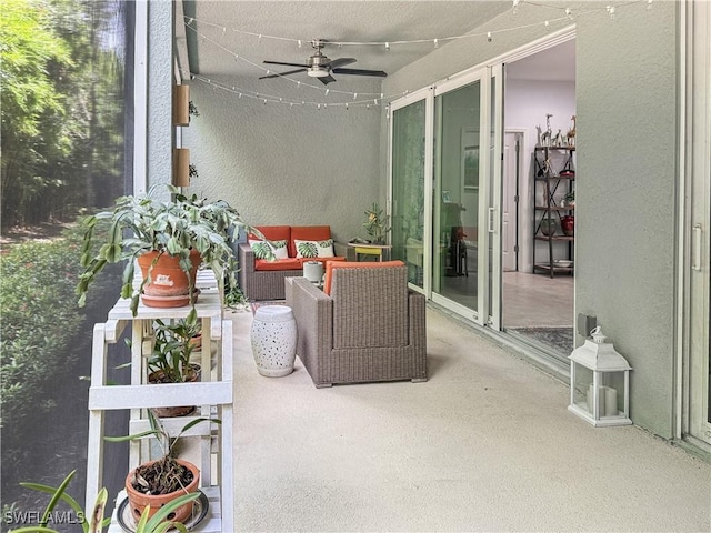 sunroom / solarium featuring ceiling fan