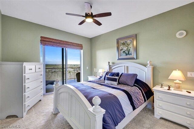 bedroom featuring access to outside, ceiling fan, and light carpet