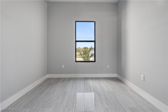 spare room with light hardwood / wood-style flooring