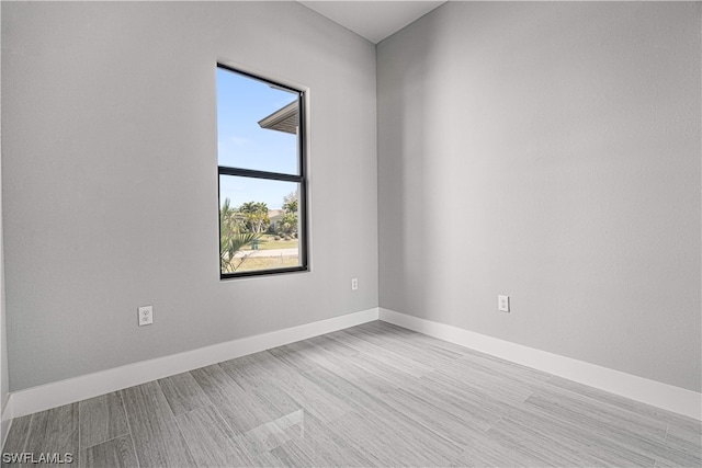 unfurnished room featuring light hardwood / wood-style flooring