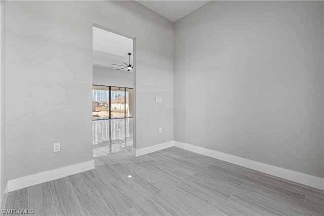 empty room with light hardwood / wood-style flooring and ceiling fan