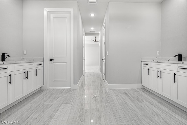 bathroom featuring vanity, ceiling fan, and hardwood / wood-style floors