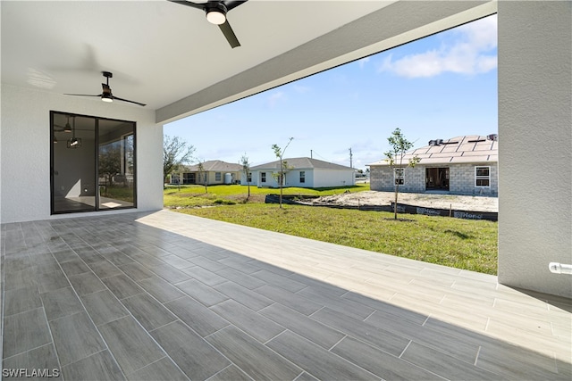 view of patio featuring ceiling fan