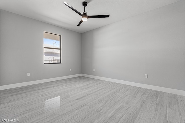 empty room featuring light hardwood / wood-style flooring and ceiling fan