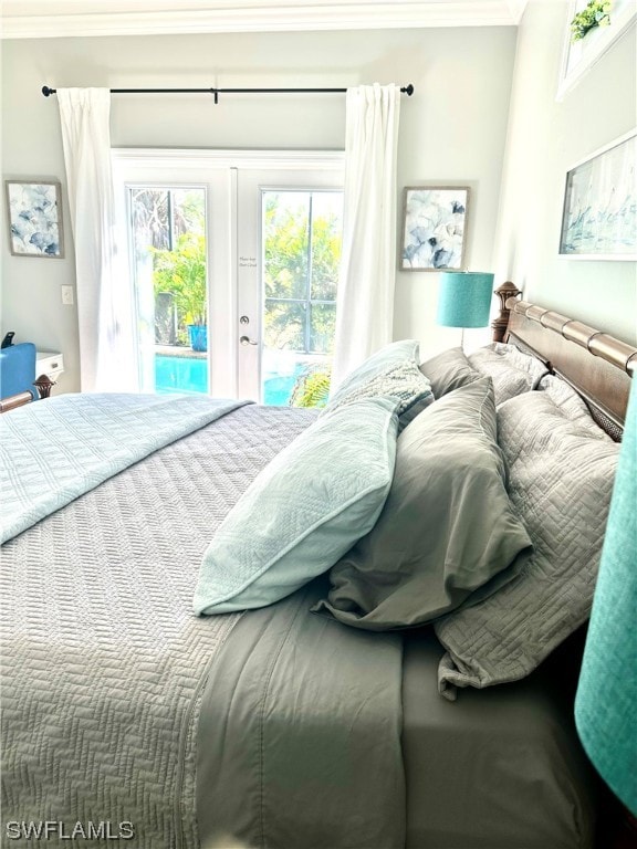 bedroom with carpet floors, access to outside, french doors, and crown molding