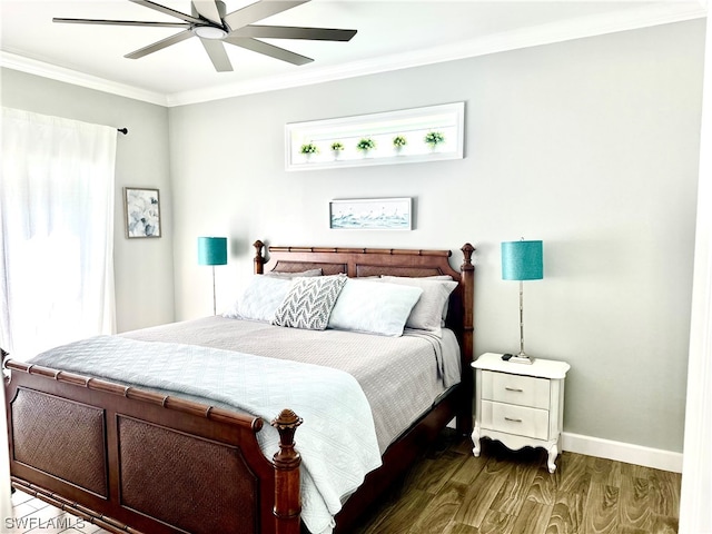 bedroom with ornamental molding, ceiling fan, and dark wood-type flooring