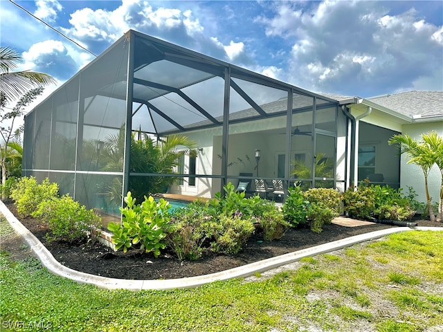 view of home's exterior with a lanai