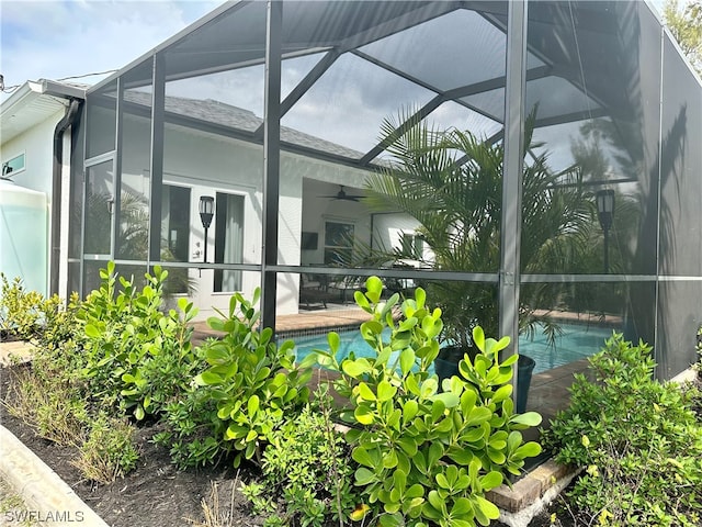 exterior space featuring ceiling fan