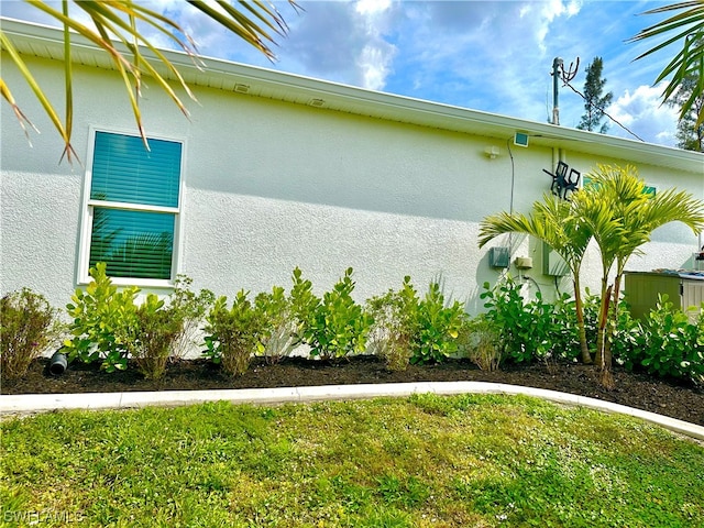 view of home's exterior with a yard