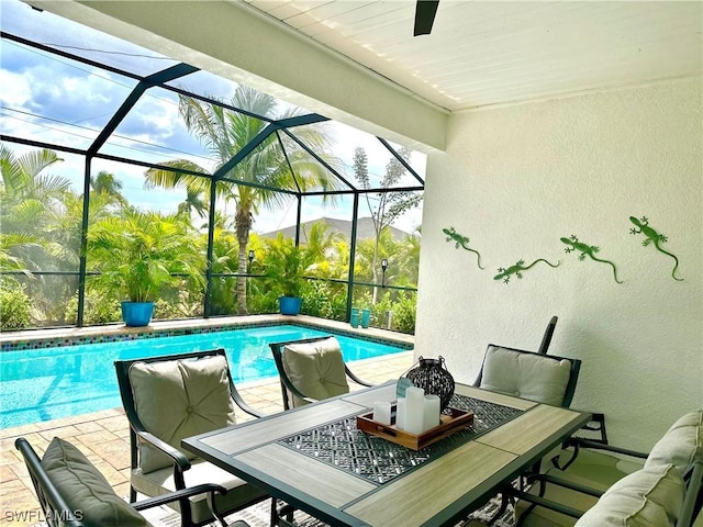 view of swimming pool featuring a mountain view, a lanai, and a patio