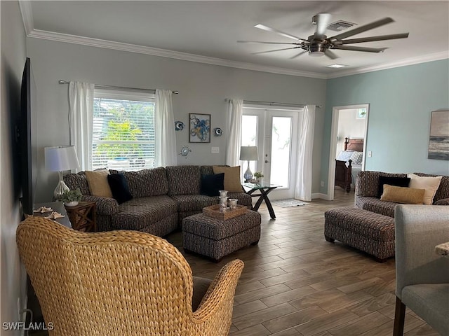 living room featuring wood-type flooring, ornamental molding, french doors, and ceiling fan