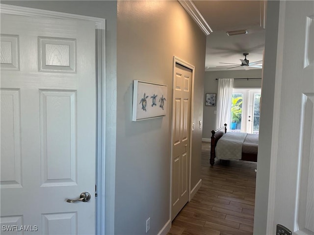 corridor featuring dark hardwood / wood-style flooring and french doors