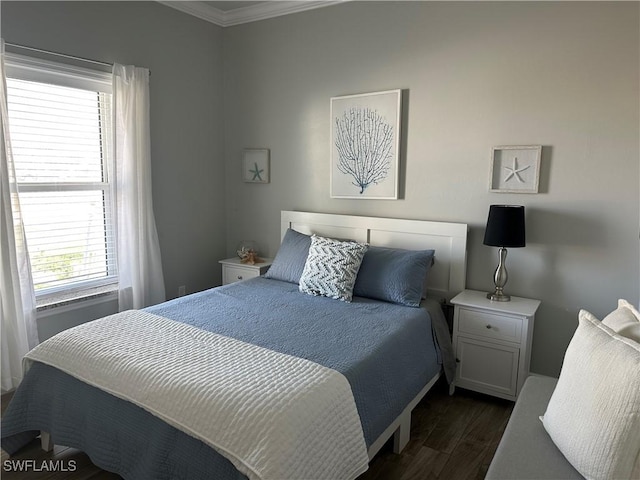 bedroom featuring dark hardwood / wood-style flooring and ornamental molding