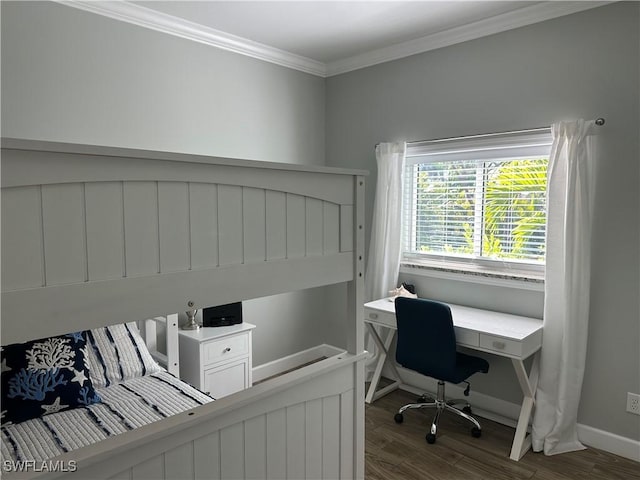 bedroom featuring dark hardwood / wood-style flooring and crown molding