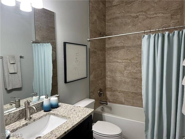 full bathroom with shower / tub combo, vanity, and toilet