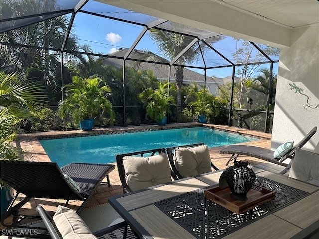 view of pool featuring a lanai