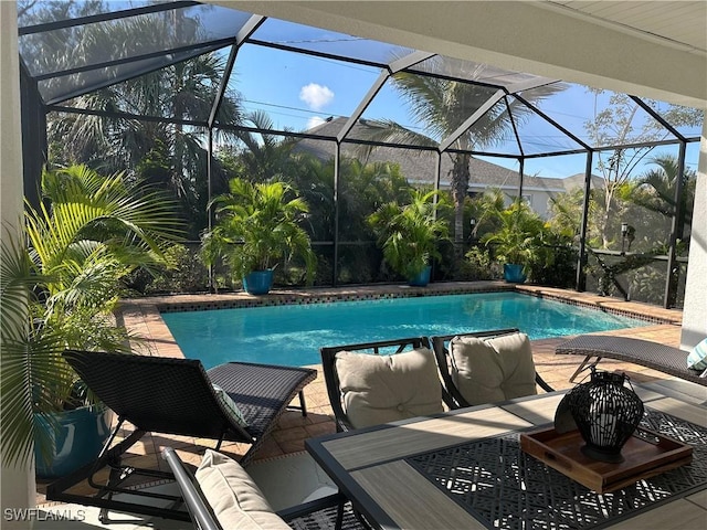 view of pool featuring a lanai and a patio