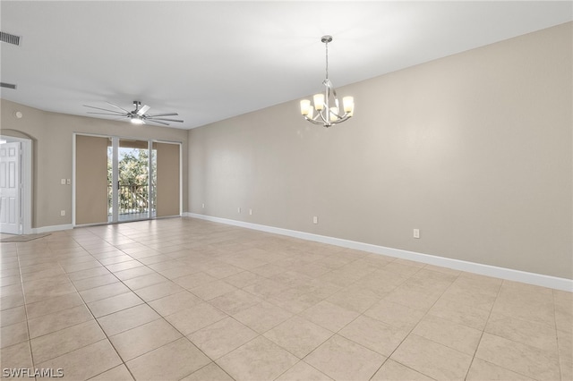 tiled empty room featuring ceiling fan with notable chandelier