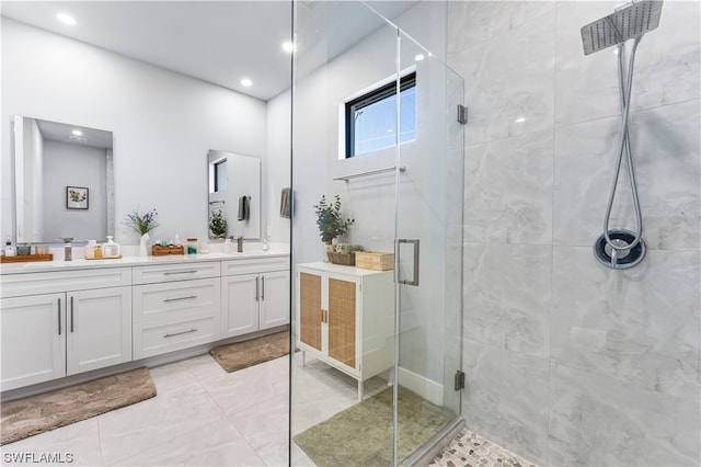 bathroom with a shower with door, tile floors, double sink, and oversized vanity