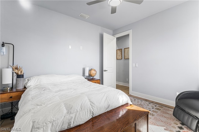 bedroom featuring ceiling fan and light hardwood / wood-style flooring