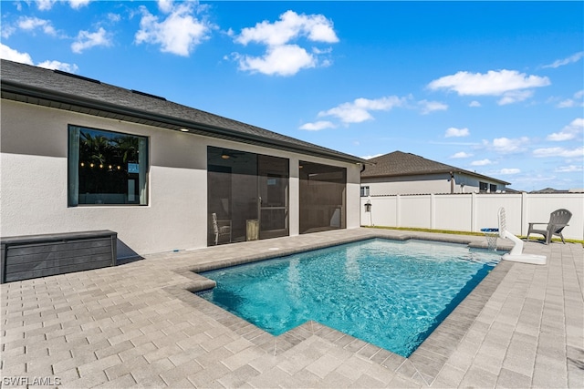 view of swimming pool featuring a patio area