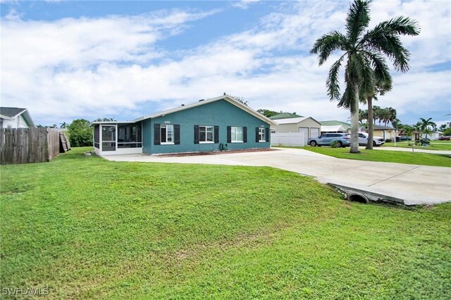 ranch-style house with a front yard and a garage