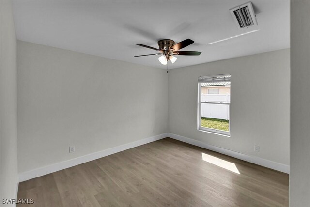 unfurnished room featuring ceiling fan and light hardwood / wood-style flooring