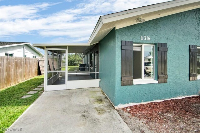 view of home's exterior featuring a sunroom