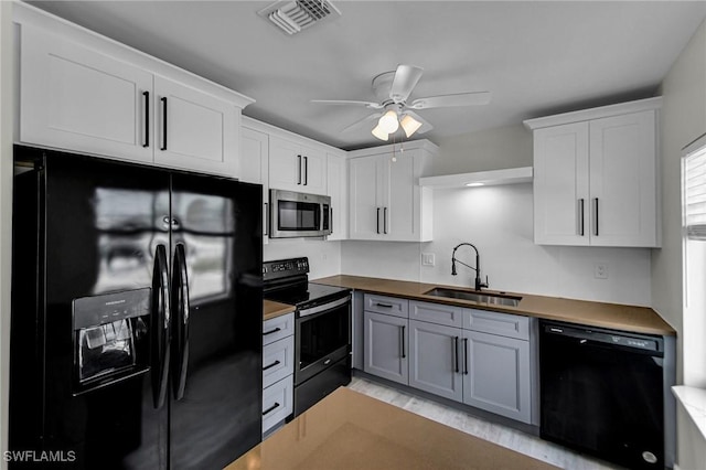 11315/17 Summerwinds Ct, Fort Myers, FL 33908 - kitchen with white cabinets, black appliances, a ceiling fan, and a sink