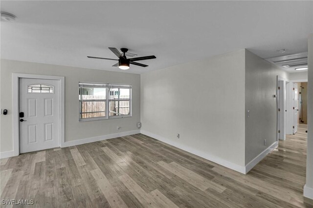 interior space with light hardwood / wood-style floors and ceiling fan