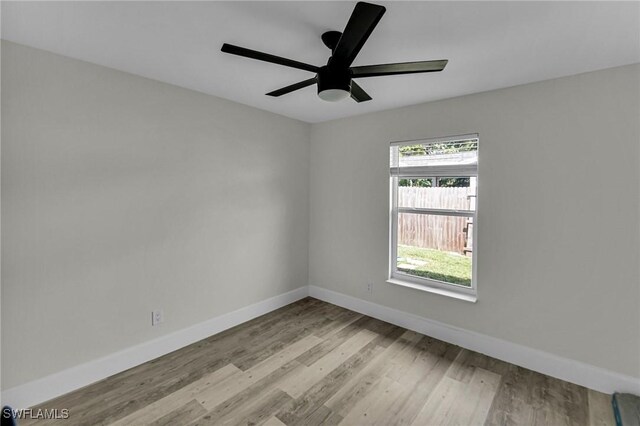 unfurnished room with ceiling fan and light hardwood / wood-style flooring