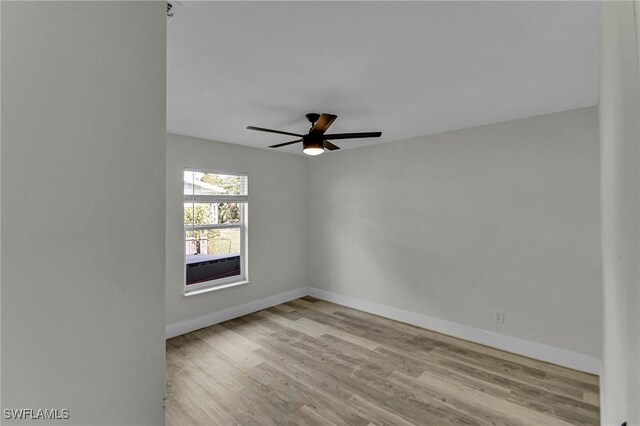 unfurnished room featuring light wood-type flooring and ceiling fan