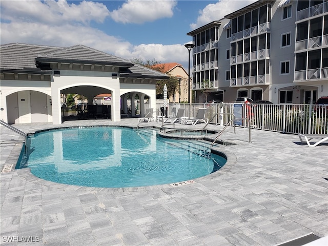 view of swimming pool featuring a patio area