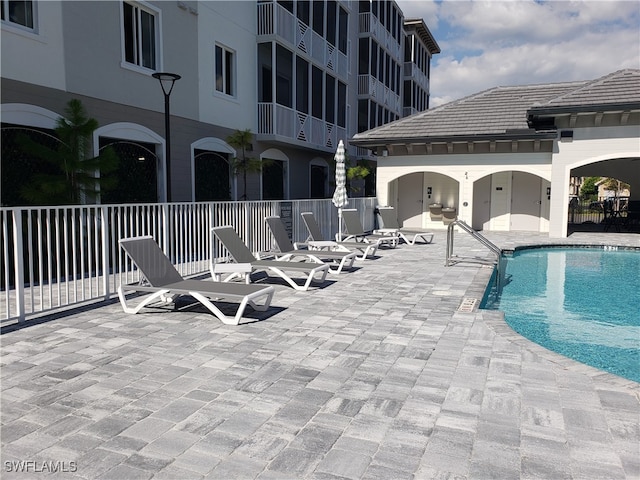 view of swimming pool featuring a patio area