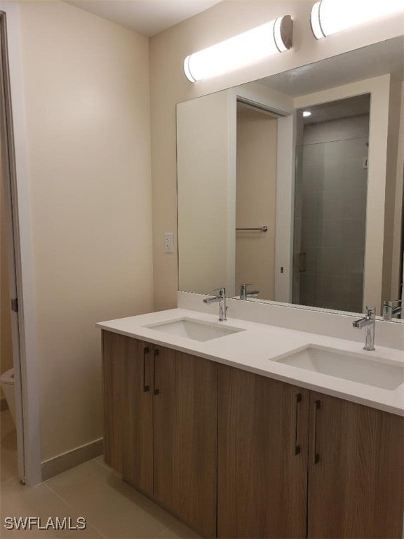 bathroom with vanity and tile patterned flooring