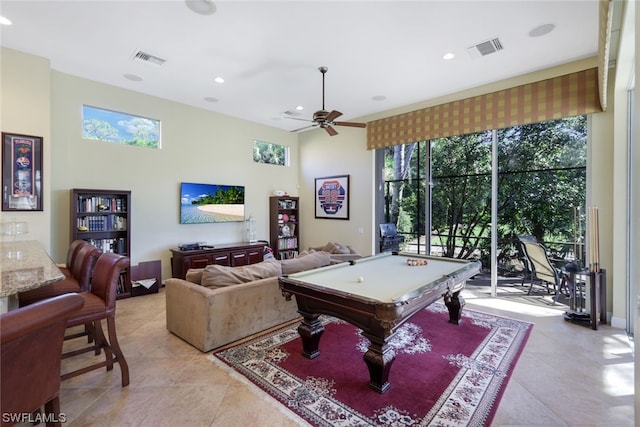 playroom featuring light tile floors, ceiling fan, and pool table