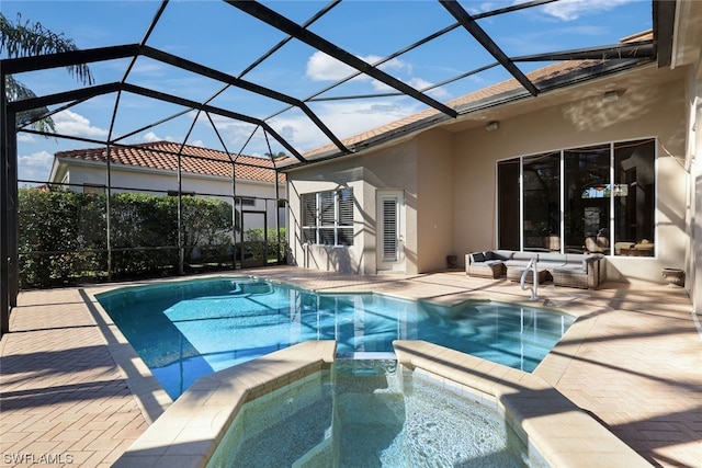 view of swimming pool featuring an in ground hot tub, an outdoor living space, glass enclosure, and a patio area