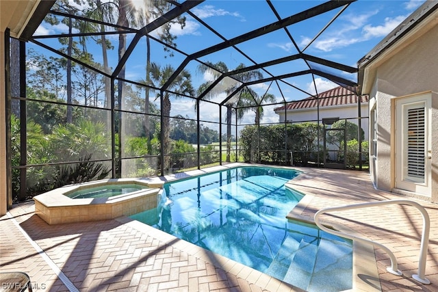 view of swimming pool with an in ground hot tub, a lanai, and a patio area