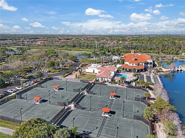 birds eye view of property with a water view