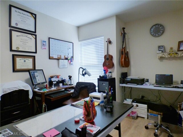 office space with light hardwood / wood-style floors